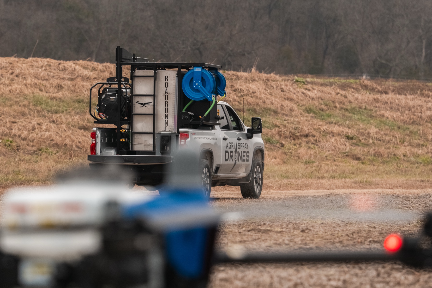 RoadRunner 350 field image with pickup and drone work